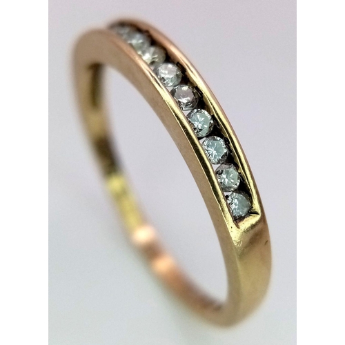 1099 - A 9K YELLOW GOLD AND DIAMOND HALF ETERNITY RING. 0.25CTW. 2.1G. SIZE T. A/S SC5.