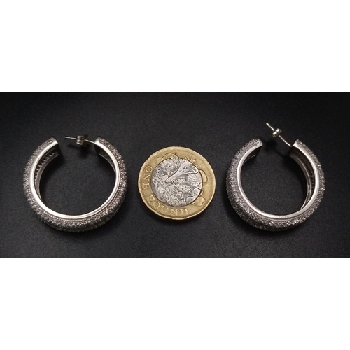 1267 - A PAIR OF STERLING SILVER FANCY STONE SET HOOP EARRINGS (three stones missing). 14.5G. SC 3084.