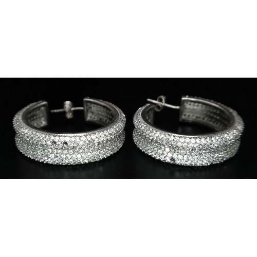 1267 - A PAIR OF STERLING SILVER FANCY STONE SET HOOP EARRINGS (three stones missing). 14.5G. SC 3084.