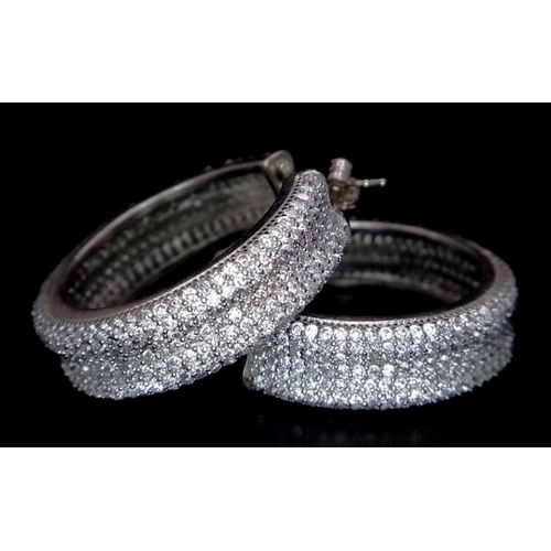 1267 - A PAIR OF STERLING SILVER FANCY STONE SET HOOP EARRINGS (three stones missing). 14.5G. SC 3084.