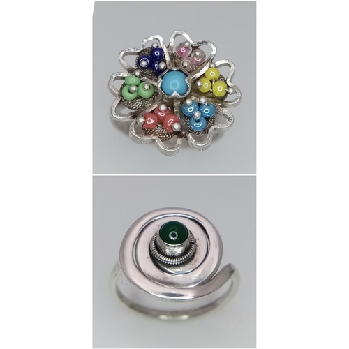 1288 - 2 X STERLING SILVER STONE SET FANCY RINGS. SWIRL DESIGN & FLOWER. 8.7G TOTAL WEIGHT. BOTH SIZE N.

r... 