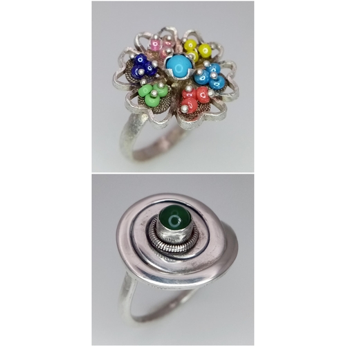 1288 - 2 X STERLING SILVER STONE SET FANCY RINGS. SWIRL DESIGN & FLOWER. 8.7G TOTAL WEIGHT. BOTH SIZE N.

r... 