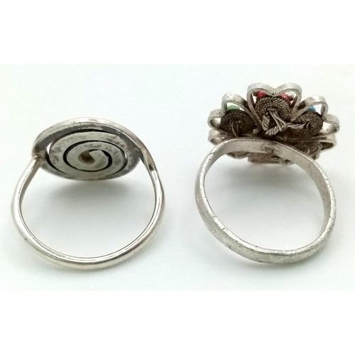 1288 - 2 X STERLING SILVER STONE SET FANCY RINGS. SWIRL DESIGN & FLOWER. 8.7G TOTAL WEIGHT. BOTH SIZE N.

r... 