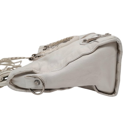 603 - A Balenciaga cream city leather handbag, silver tone hardware, black cloth interior with zip pocket,... 