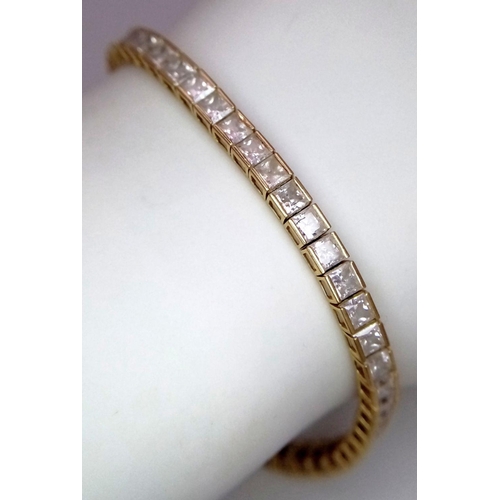 1178 - An 18K Yellow Gold, White Zircon Tennis Bracelet. 18cm. 10.3g total weight.