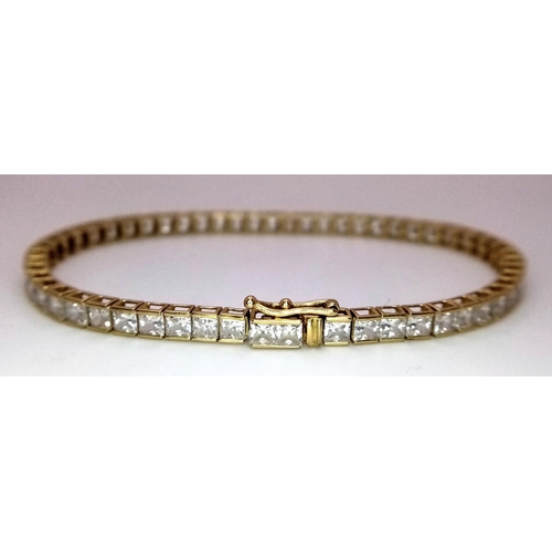 1178 - An 18K Yellow Gold, White Zircon Tennis Bracelet. 18cm. 10.3g total weight.