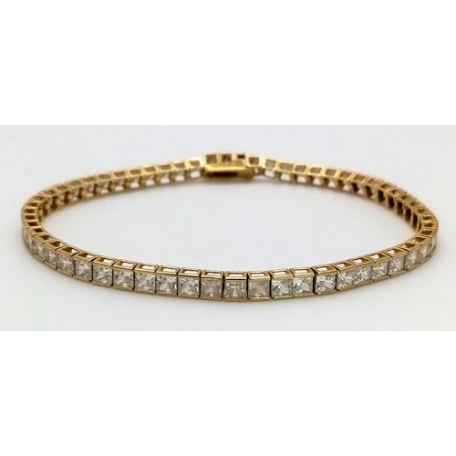 1178 - An 18K Yellow Gold, White Zircon Tennis Bracelet. 18cm. 10.3g total weight.