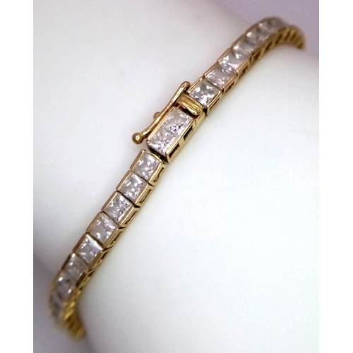 1178 - An 18K Yellow Gold, White Zircon Tennis Bracelet. 18cm. 10.3g total weight.