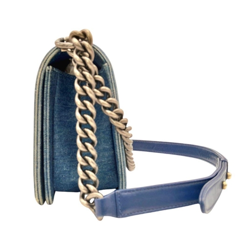 610 - A Chanel Navy Tweed and Leather Boy Bag. Tweed and leather exterior with silver-tone chain and leath... 