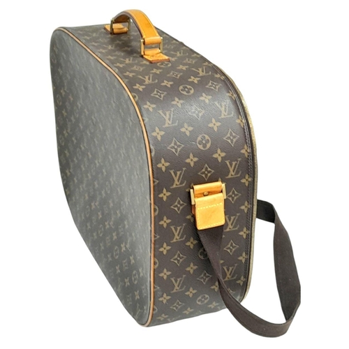 1009 - A Louis Vuitton Packall Travel Bag. Monogram coated canvas exterior with leather trim, single handle... 