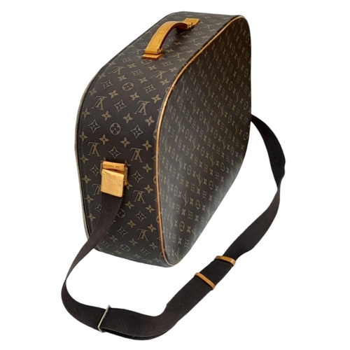 1009 - A Louis Vuitton Packall Travel Bag. Monogram coated canvas exterior with leather trim, single handle... 