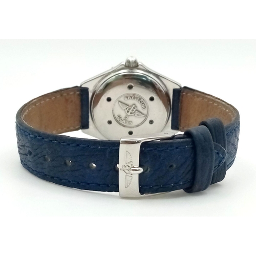 1234 - A Breitling J Class Quartz Ladies Watch. Blue leather strap. Case - 30mm. Blue dial with date window... 