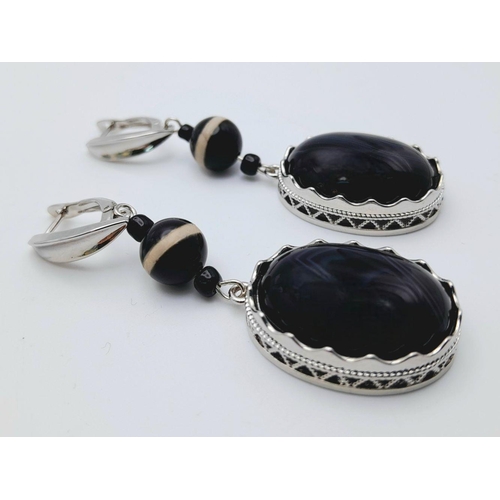 1417 - A Pair of 925 Silver with Black Agate set Drop Earrings. 7cm drop , 21.7g total weight.