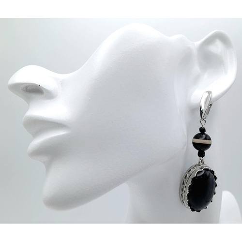 1417 - A Pair of 925 Silver with Black Agate set Drop Earrings. 7cm drop , 21.7g total weight.