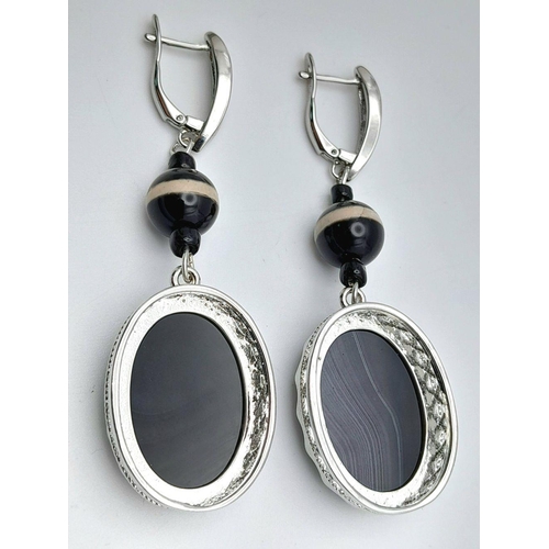 1417 - A Pair of 925 Silver with Black Agate set Drop Earrings. 7cm drop , 21.7g total weight.