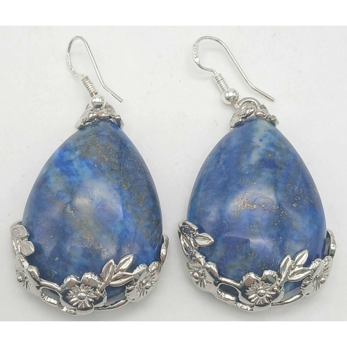 1409 - A pair of teardrop Lapis Lazuli earrings. 55mm drop. 30g total weight.