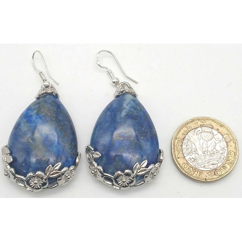 1409 - A pair of teardrop Lapis Lazuli earrings. 55mm drop. 30g total weight.