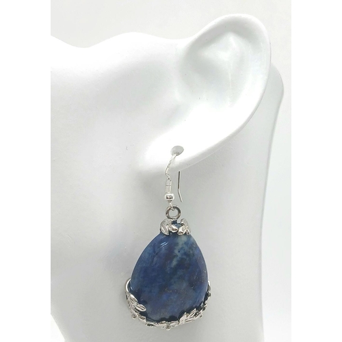 1409 - A pair of teardrop Lapis Lazuli earrings. 55mm drop. 30g total weight.