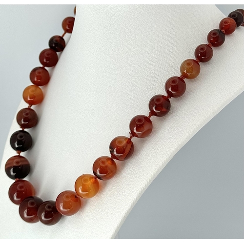 1388 - A Vintage Graduated Striped Red Agate Bead Necklace. 72cm