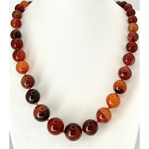 1388 - A Vintage Graduated Striped Red Agate Bead Necklace. 72cm