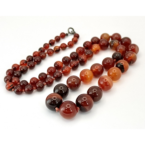 1388 - A Vintage Graduated Striped Red Agate Bead Necklace. 72cm