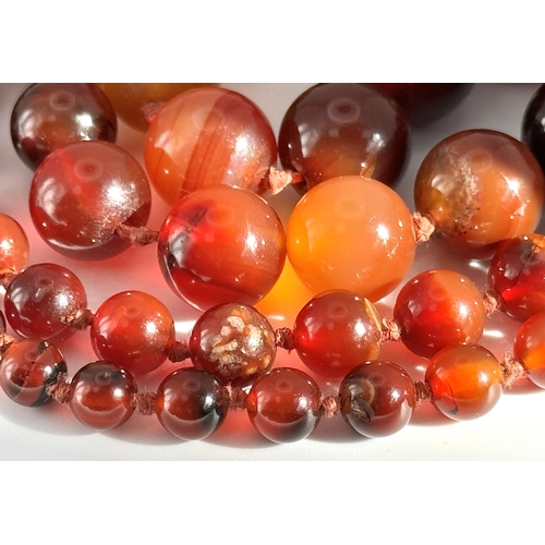 1388 - A Vintage Graduated Striped Red Agate Bead Necklace. 72cm