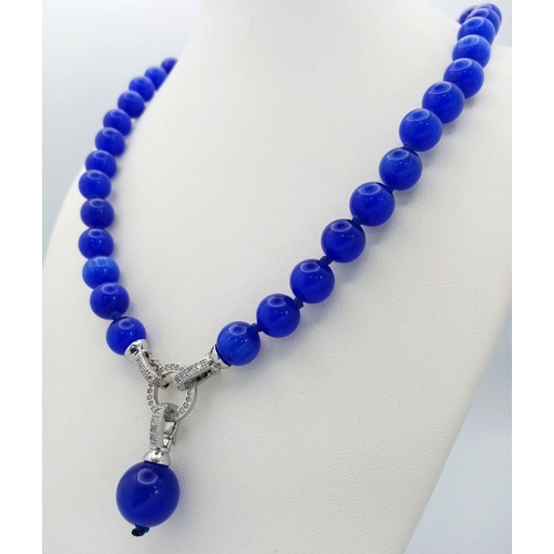 1450 - A Blue Cats Eye Necklace with Hanging Pendant. 42cm necklace length.