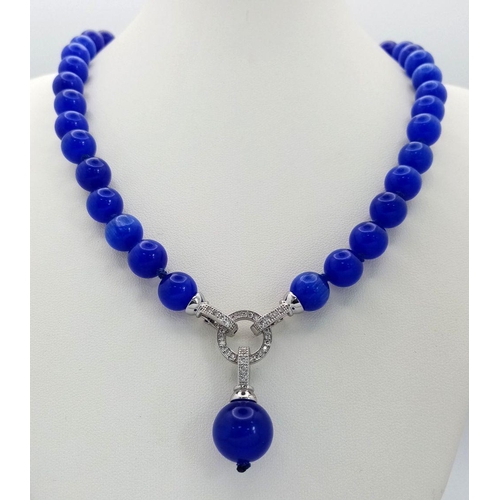 1450 - A Blue Cats Eye Necklace with Hanging Pendant. 42cm necklace length.