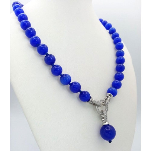 1450 - A Blue Cats Eye Necklace with Hanging Pendant. 42cm necklace length.