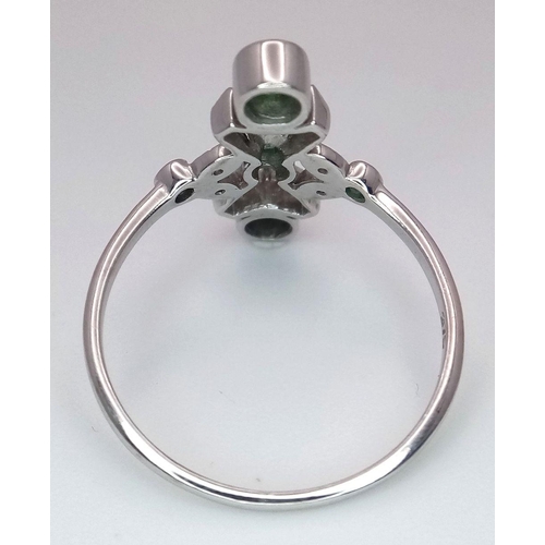 444 - A Stylish Art Deco Design 9 Carat White Gold Emerald and Clear Stone Set Ring Size Q. The Ring Measu... 