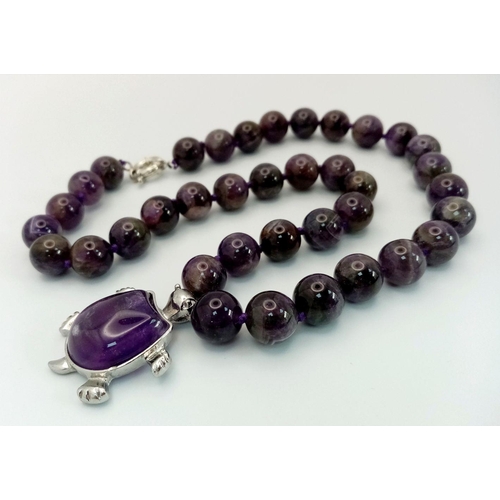 471 - An Amethyst Bead Necklace with Hanging Amethyst Turtle Pendant. Pendant - 4cm. Necklace 44cm.