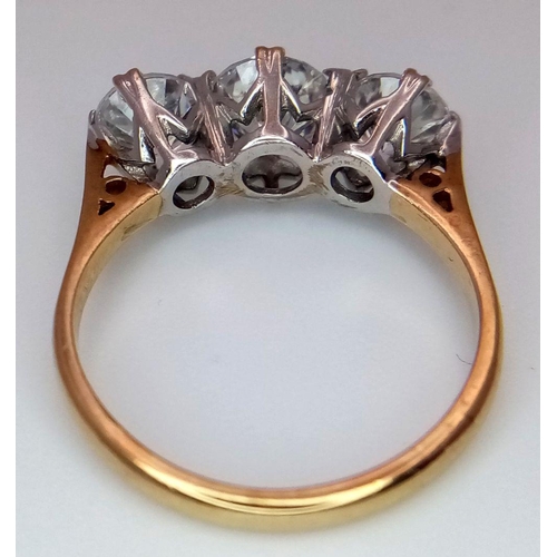 674 - A 9K Yellow Gold Three Stone Zircon Ring. Size K. 2.5g total weight. Comes with a case.