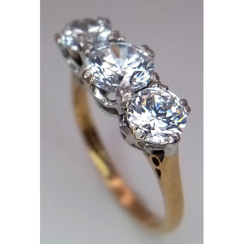 674 - A 9K Yellow Gold Three Stone Zircon Ring. Size K. 2.5g total weight. Comes with a case.