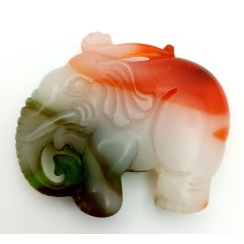 886 - A Chinese Multi-Colour Jade Elephant Pendant. 5cm