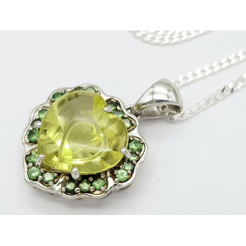 1013 - A Sterling Silver Citrine and Peridot Set Pendant Necklace. 46cm Length. Pendant Measures 2cm Wide. ... 