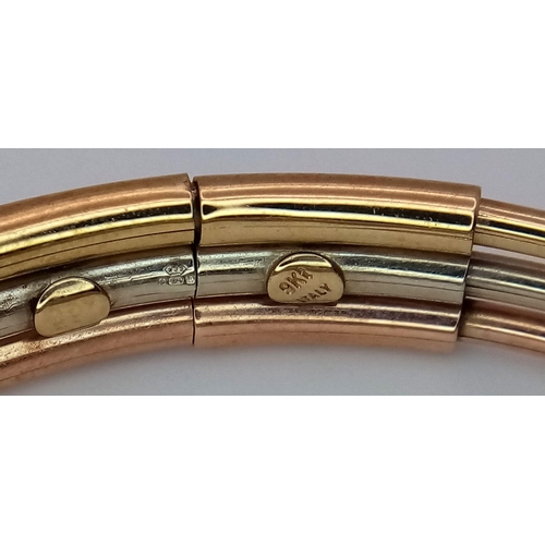 17 - A Fancy Italian 9K Tri-Colour Gold Bangle. Yellow, white and rose gold bars. 58mm inner diameter. 9.... 