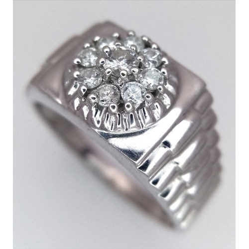 205 - A Gents 9K White Gold Diamond Ring. 0.5ctw of brilliant round cut diamonds with decorative geometric... 