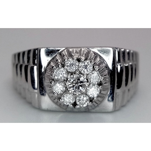 205 - A Gents 9K White Gold Diamond Ring. 0.5ctw of brilliant round cut diamonds with decorative geometric... 