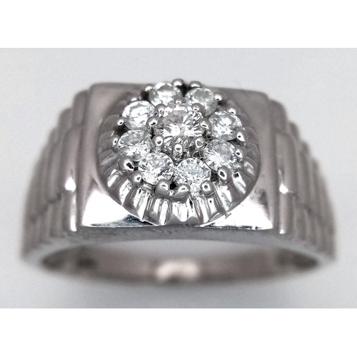 205 - A Gents 9K White Gold Diamond Ring. 0.5ctw of brilliant round cut diamonds with decorative geometric... 