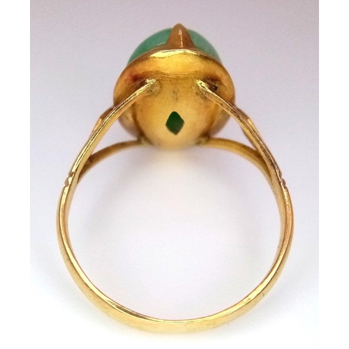 299 - A 20K Yellow Gold (tested as) Cabochon Set Ring (thought to be Jade), 15x8mm jade size, 4g total wei... 