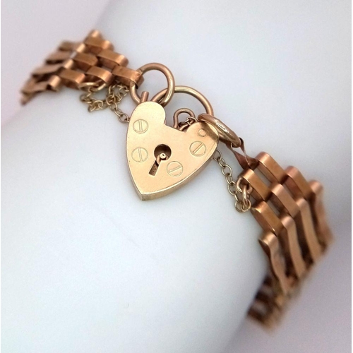 3 - A Vintage 9K Yellow Gold Gate Bracelet with Heart Clasp. T-bar charm. 18cm. 10.68g weight.