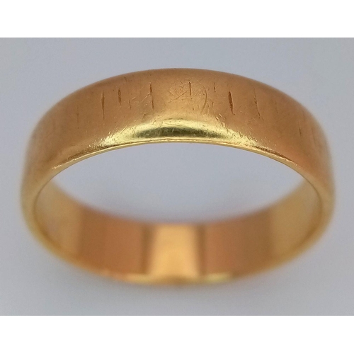 31 - An 18K Yellow Gold Band Ring. Full UK hallmarks. 5mm width. Size L1/2. 3.7g.