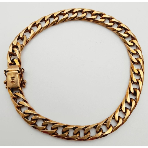 38 - A Heavy 9K Yellow Gold Curb Link Bracelet. 20cm. 22.4g