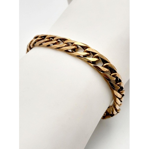 38 - A Heavy 9K Yellow Gold Curb Link Bracelet. 20cm. 22.4g