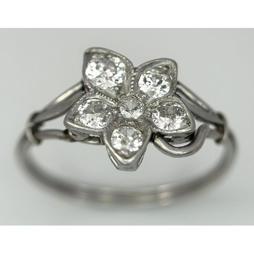 403 - A Platinum (tested as) Diamond Flower Ring, 0.39ct diamond weight, 2.48g total weight, size N 1/2. 
... 