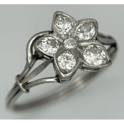 403 - A Platinum (tested as) Diamond Flower Ring, 0.39ct diamond weight, 2.48g total weight, size N 1/2. 
... 