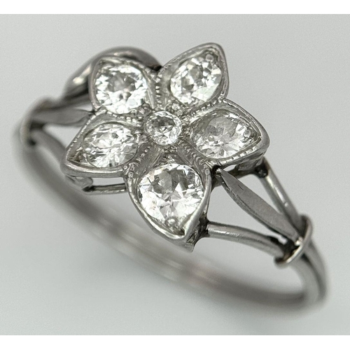 403 - A Platinum (tested as) Diamond Flower Ring, 0.39ct diamond weight, 2.48g total weight, size N 1/2. 
... 