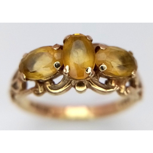 424 - A 9K yellow gold vintage citrine trilogy ring, size N 1/2 (citrine: 1.35ct) 2.6g. Ref: TC04