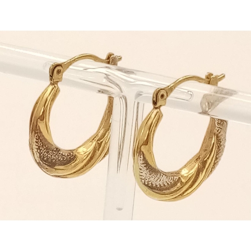 512 - A Pair of 9K Yellow and White Gold Creole Hoop Earrings. 1.5g total weight.