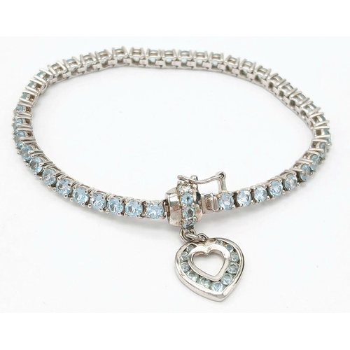 535 - Sterling Silver Aquamarine Set Heart Charm Tennis Bracelet. 19cm Length. Set with 4mm Round Cut Aqua... 